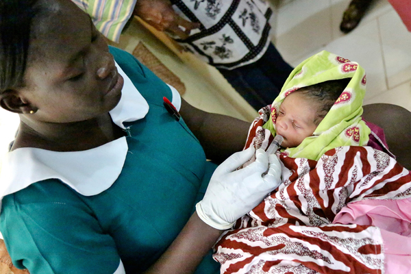 Nurse in North Ghana with baby